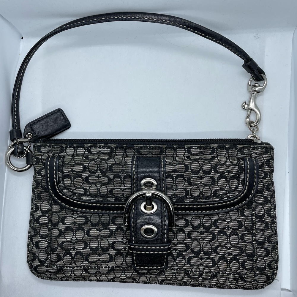 Wristlet purse by Coach. (Black)